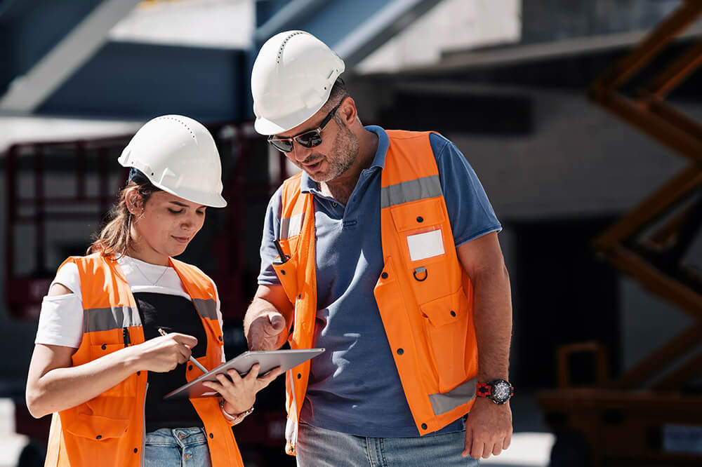 trackit3 two construction workers looking at a tablet